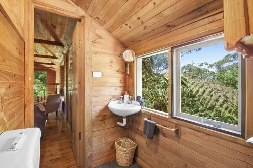 a bathroom with a sink and a window at Jalscene in Mount Wilson