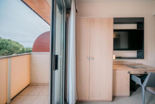 a kitchen with a view of the ocean at Hotel Europa Lignano in Lignano Sabbiadoro