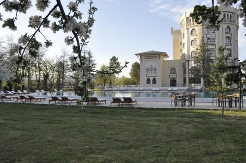 a building with benches and a fountain in front of it at CONNECT THERMAL HOTEL in Ankara