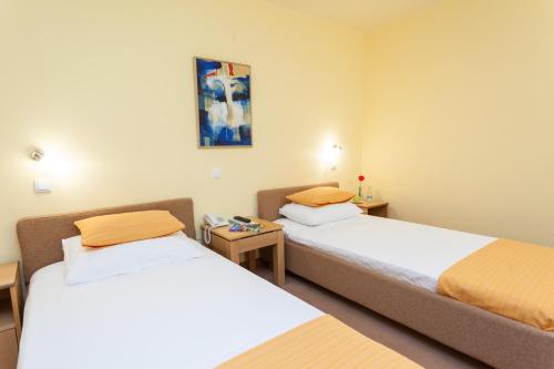 Кровать или кровати в номере Čigota Medical & Spa Centre