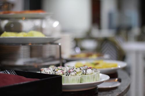 a cake with candy canes on top of a counter at Hotel Sandakan in Sandakan