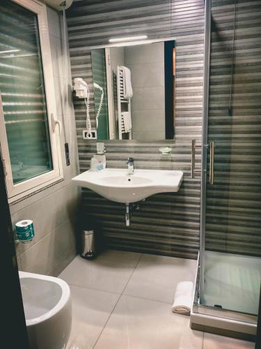 a bathroom with a sink and a shower at Hotel Niagara in Catanzaro Lido