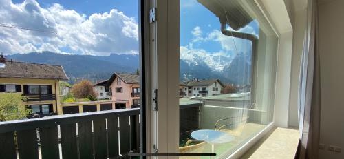 a balcony with a view of a mountain at Ferienhaus Butterfly 2 in Garmisch-Partenkirchen