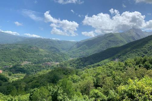 a view of a valley with mountains in the distance at La Terrazza sulle Apuane in Fivizzano