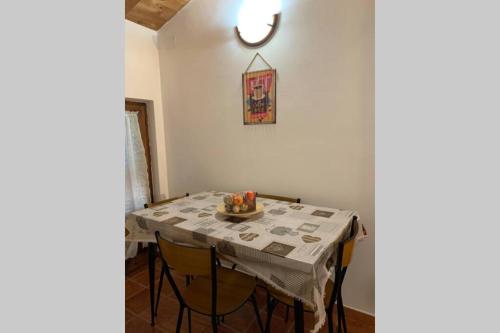 a dining room table with a table cloth on it at La Terrazza sulle Apuane in Fivizzano