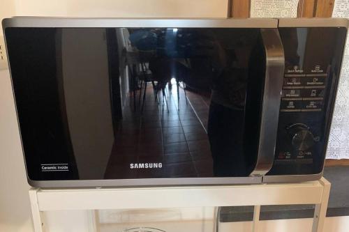 a microwave oven sitting on top of a table at La Terrazza sulle Apuane in Fivizzano