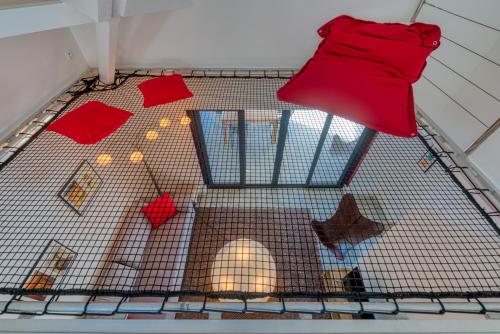 a bird cage with a red glove on top of it at One bedroom loft marina Anse Marcel in Cul de Sac