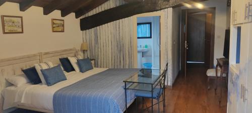 Postel nebo postele na pokoji v ubytování Hostal Mendaurpe