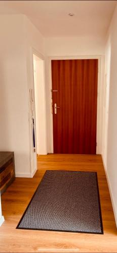 a room with a black rug in front of a door at Ferienhaus Butterfly 2 in Garmisch-Partenkirchen