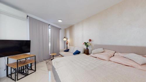 A bed or beds in a room at Štýlový apartmán pri Chopku