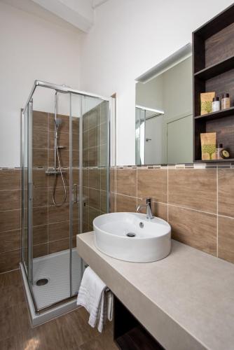 a bathroom with a sink and a shower at Hotel Garni Corona in Menaggio