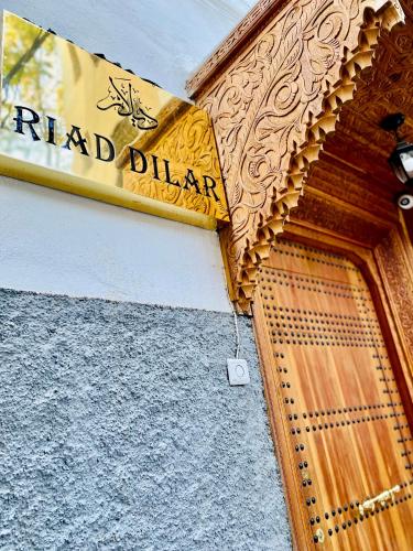 a sign above a door of a building at Riad Dilar Fes & Spa in Fès