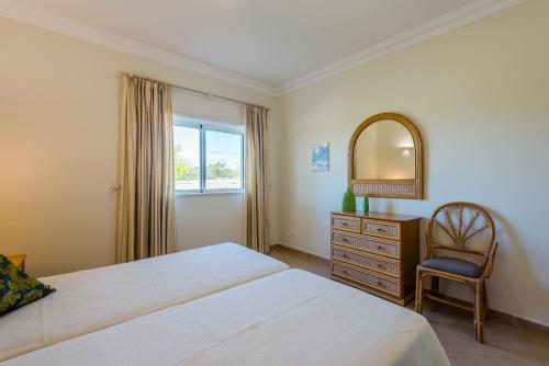 En eller flere senger på et rom på Casa Ocean Golf - Boavista Resort