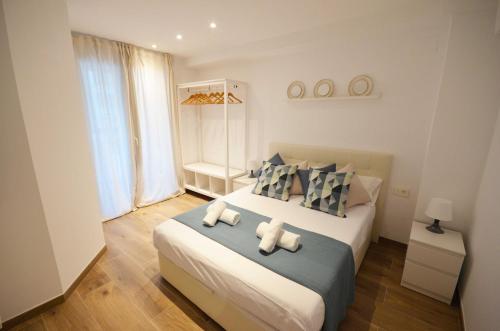 a bedroom with a large bed with two pillows at Golive Deluxe in Cambrils