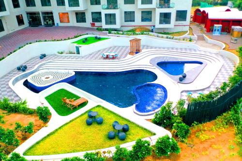 an overhead view of a swimming pool in a house at The Nest Luxury Resort in Jaipur