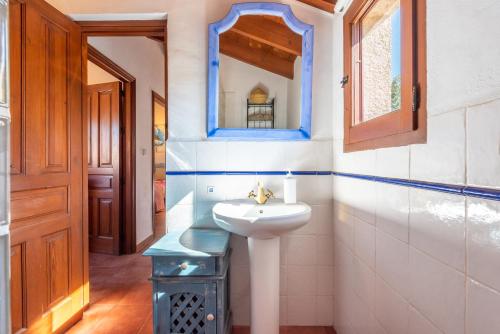 a bathroom with a sink and a mirror at Finca Las Nuevas Casa Maria Arriba in Alora