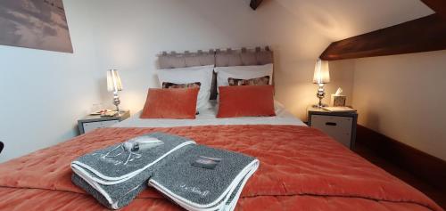 Le Noroit Chambres d'Hôtes tesisinde bir odada yatak veya yataklar