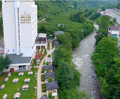 an aerial view of a river next to a hotel at Jolnar garden hotel in Macka