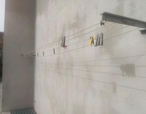 a group of birds sitting on the side of a wall at Apartment in Sardinia in Decimomannu