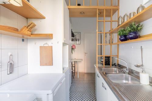 a small kitchen with a sink and a counter at iFlat Bright Apartment near Caracalla Baths in Rome