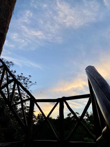 a wooden bridge with the sky in the background at Blue Monkey Chemuyil in Chemuyil