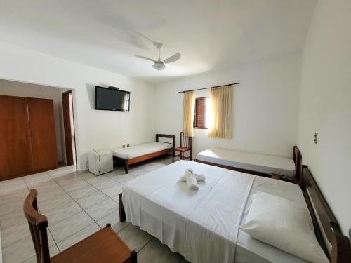 Ένα ή περισσότερα κρεβάτια σε δωμάτιο στο Hotel Guarini