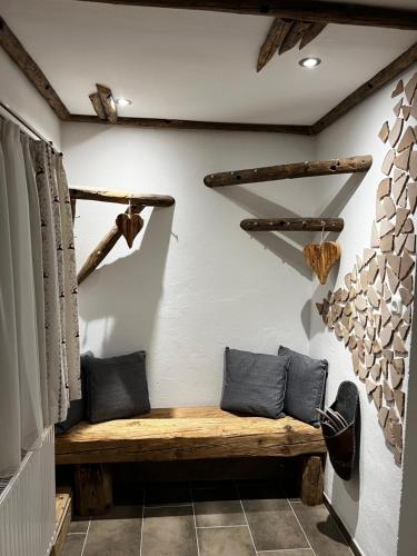 a room with a wooden bench in a room at Gaisbergblick in Molln