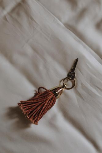 a pair of scissors sitting on top of a bed at Parkhotel Mondschein, a Member of Design Hotels in Bolzano