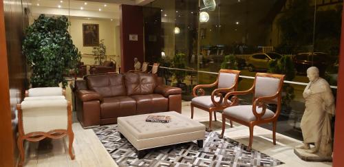 a man standing in a room with furniture in a store at Apart Hotel San Martin in Lima