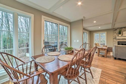 a dining room with a wooden table and chairs at Harbor Springs Retreat about 5 Mi to Downtown and Beach! in Harbor Springs