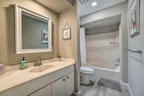 a bathroom with a sink and a toilet and a shower at Harbor Springs Retreat about 5 Mi to Downtown and Beach! in Harbor Springs