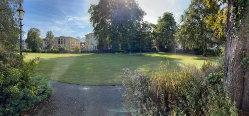 a golf course with a hole in the grass at Beautiful Georgian Duplex in Gloucester