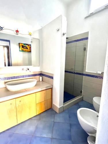 a bathroom with a sink and a toilet and a shower at B&B Villa Regine camera con terrazza a Forio in Forio d'Ischia