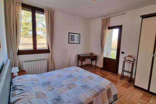 A bed or beds in a room at Appartamento spazioso Le Vitterelle B&B