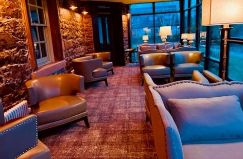 a waiting room with couches and chairs in a building at Moffat House in Moffat