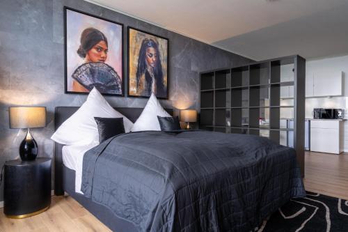Säng eller sängar i ett rum på GelsenDesign II - Gemütliches Premium Apartment