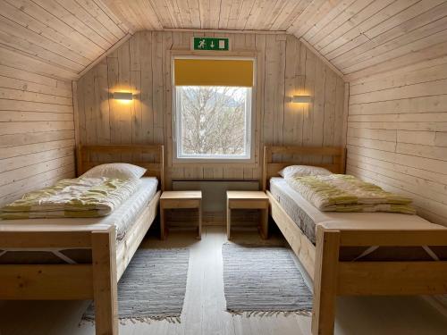 Кровать или кровати в номере Dalsvallen