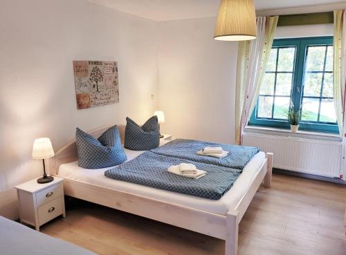 מיטה או מיטות בחדר ב-Pension Landhaus Teichgraf