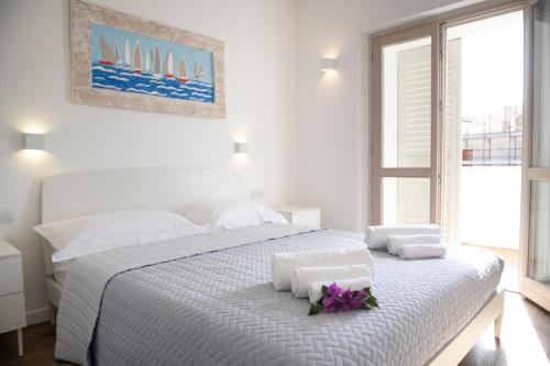 Postel nebo postele na pokoji v ubytování Sardinia Gold Luxury Apartment