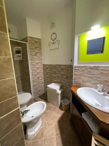 a bathroom with a sink and a toilet at B&b da Maria in Bisceglie