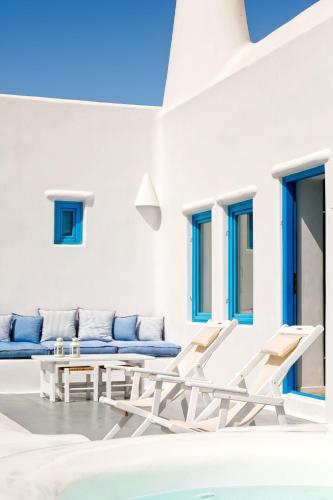a white room with a couch and chairs at Illusion Villa - Exceptional Private Villa in Akrotiri
