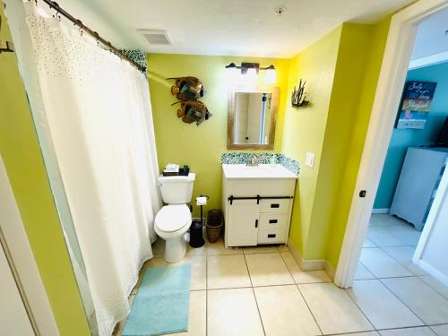 a bathroom with a toilet and a sink at #808 Lovers Key Beach Club in Fort Myers Beach