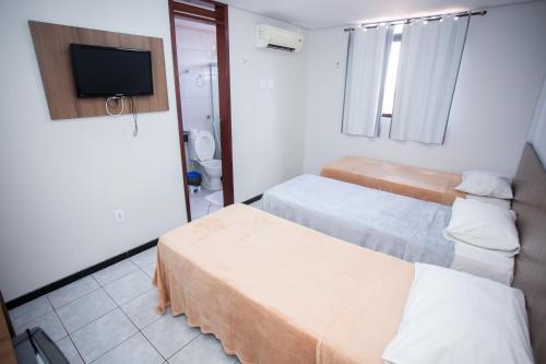 Ένα ή περισσότερα κρεβάτια σε δωμάτιο στο Hotel Campina Executivo