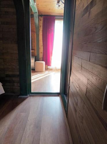 an open door to a room with a window at Robinson Vila Kitokret in Kutjevo