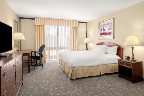 Ένα ή περισσότερα κρεβάτια σε δωμάτιο στο Montana Trailhead Inn