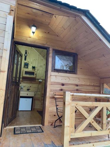 an inside view of a cabin with a kitchen in it at Oaza mira, Kokin Brod in Nova Varoš