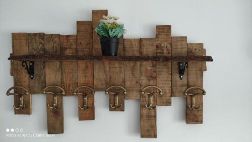 a shelf made out of reclaimed wood with handcuffs at Carpe diem in Galatas