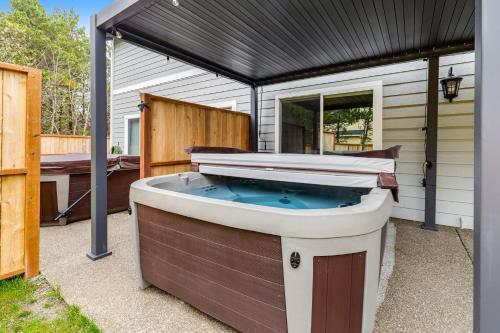 a hot tub on the side of a house at SurfSide in Westport
