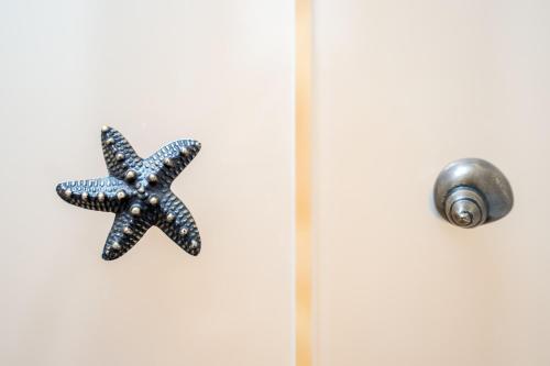 a blue and white starfish on a door at Hotel Belair in Sorrento