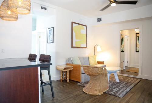 a living room with a couch and a table at Fitch Lodge - Key West Historic Inns in Key West